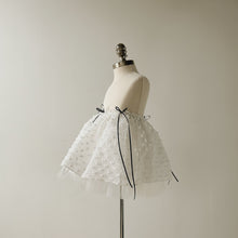 Load image into Gallery viewer, White polka dot skirt on a mannequin against a plain background